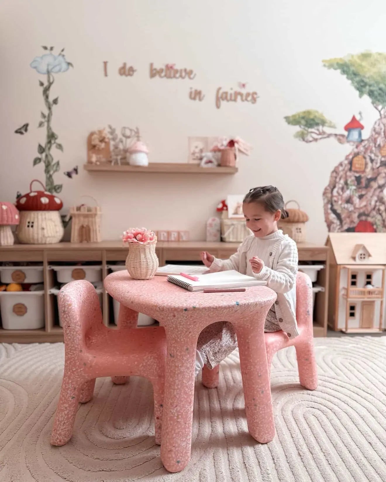 Toddler playing on her confetti table and chair set from jellybean interiors
