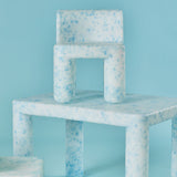 Speckled blue and white chair on a matching blue background