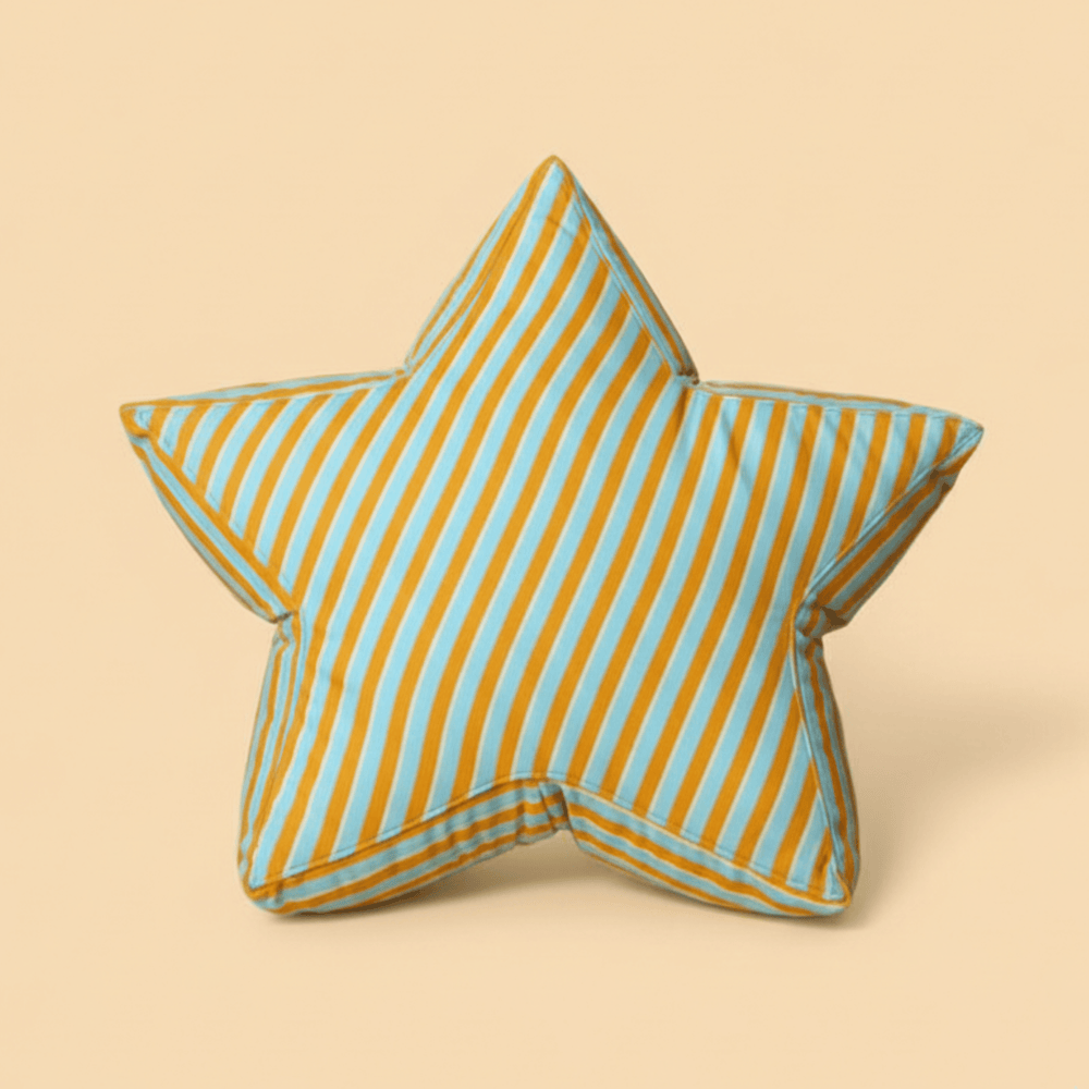 Large star-shaped floor cushion called the Superstar Crash Pad, featuring Orange, blue and yelllow stripes on a light orange background.