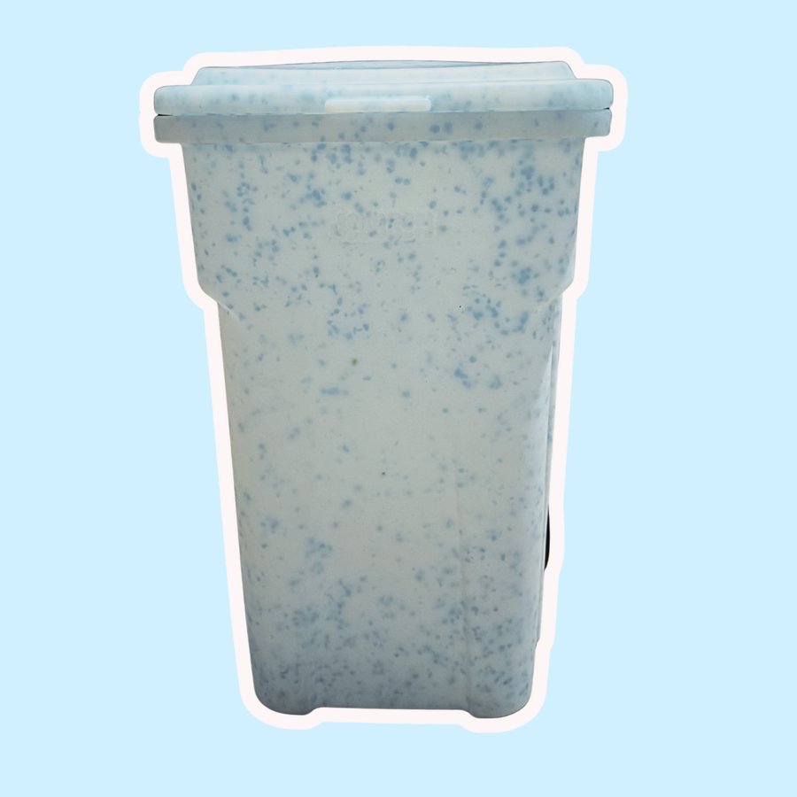 Speckled blue and gray container on a light blue background