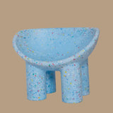 Blue Kids Bucket chair with multicolored speckles on a beige background