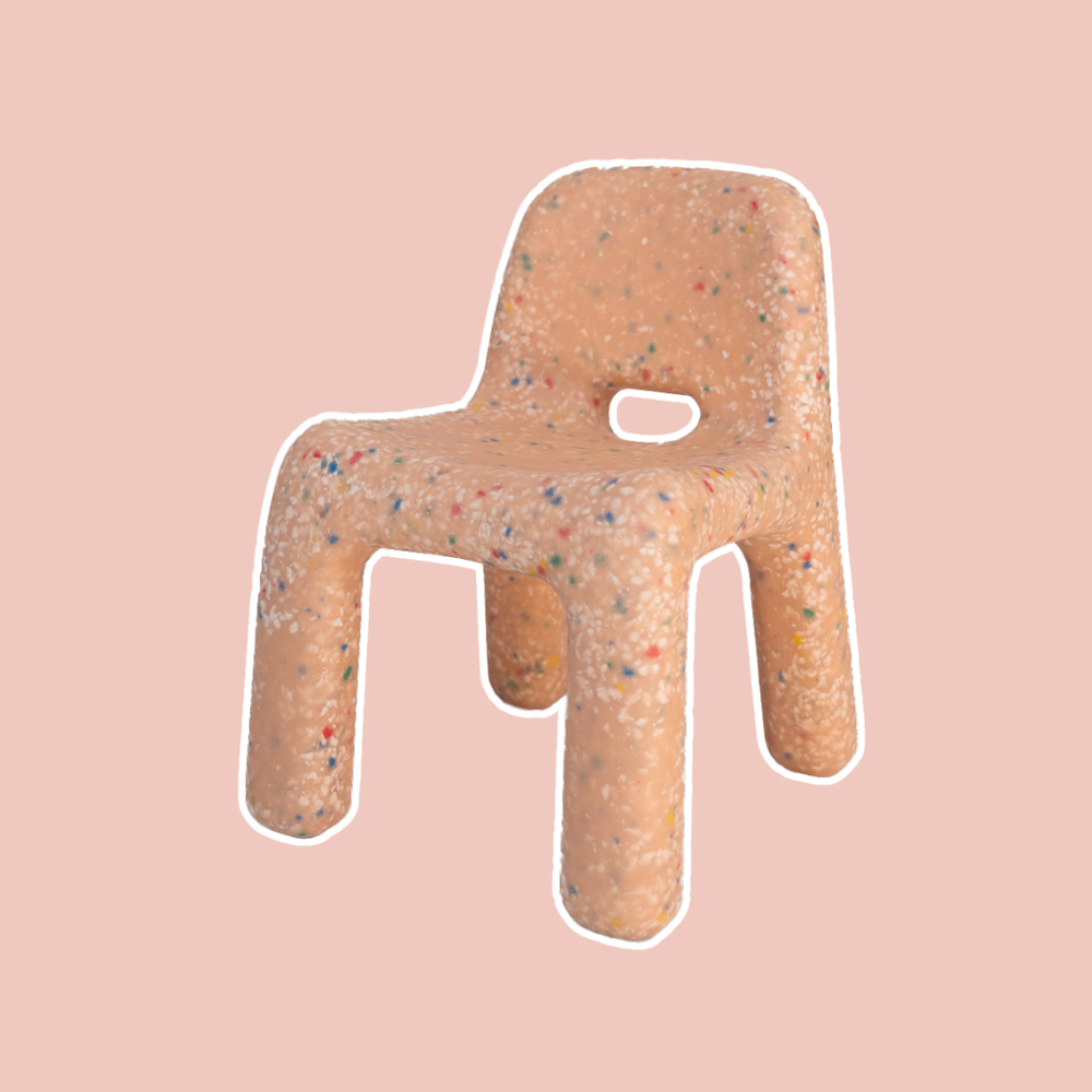 Peach Confetti Chair with a speckled pattern on a beige background