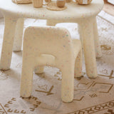 Sand Confetti chairs with a patterned rug underneath