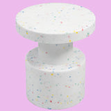 White confetti side table on pink background
